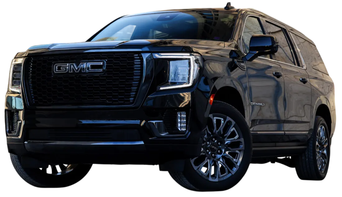 Pricing 9 A 2025 GMC Yukon parked outside a building, promoting airport pickups and family travel with premium comfort in Chicago.